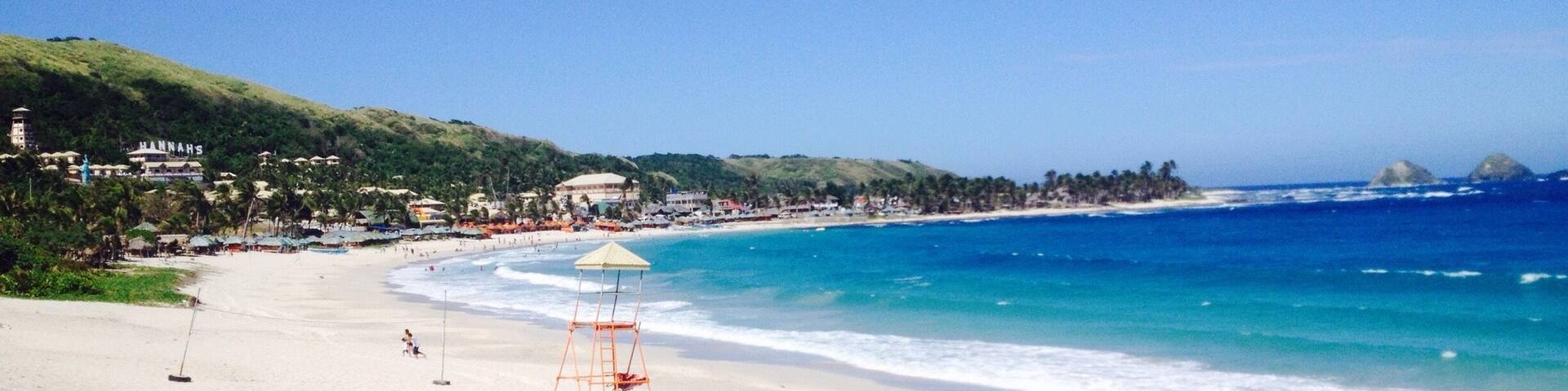 another place to add in your planner, a long white sand beach, cool blue water and big waves good for water activity! come and visit. #blue travel photo contest # beachbound