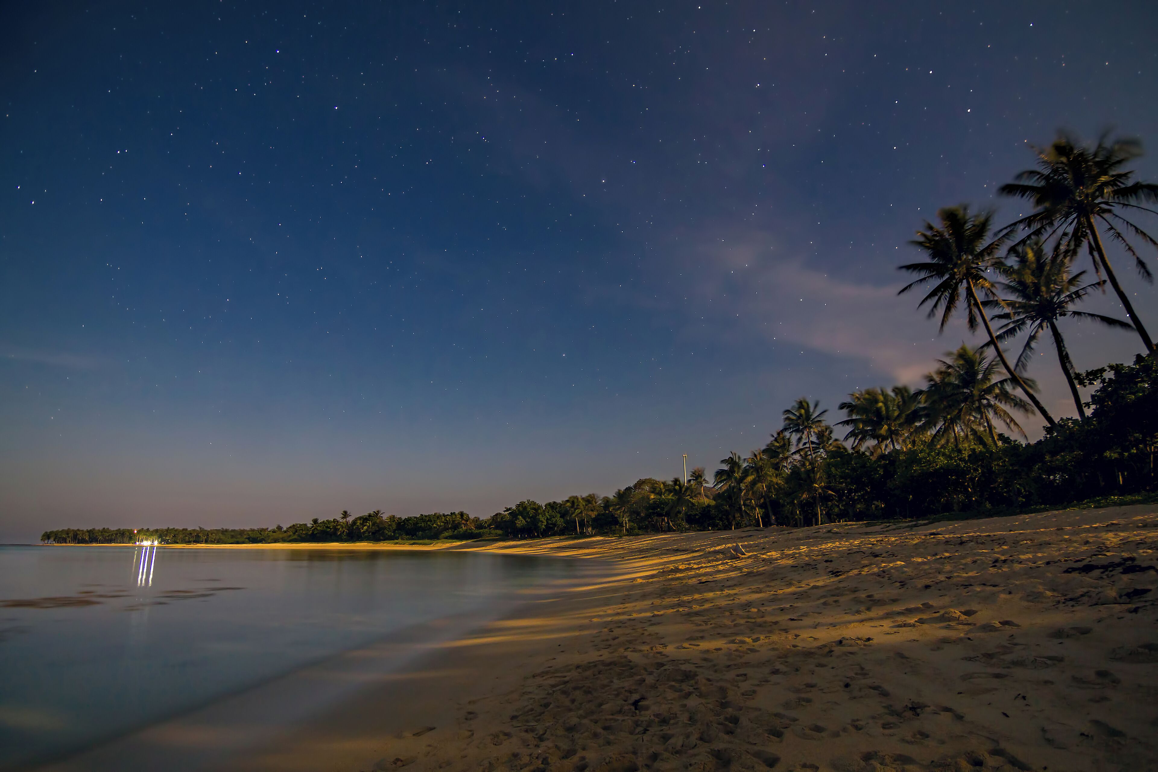 The rising moon casts long shadows on Saud Beach in Ilocos Norte, Philippines. For the longest time I have always been fascinated by moonlit shores, easily transporting me to a place that is both real and dreamlike.
