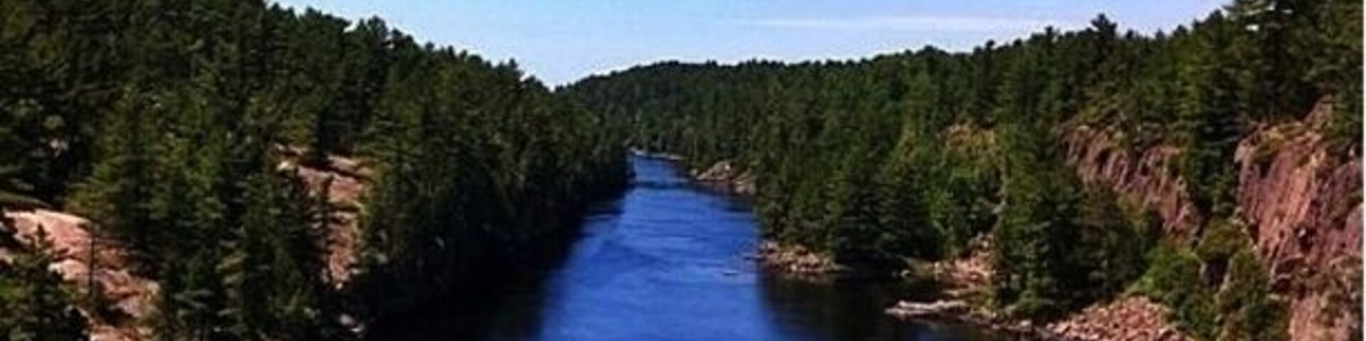 French River Provincial Park. When traveling up north make sure to check out the suspension bridge here. It costs nothing to venture to the park and has a great visitors centre and trails. Be careful when hiking as Canada's most poisonous snake has made its home here. Some history...The French River was the main Water Highway to the west in Canada from 1600 to the 1820's. The Ojibwe name for the river is Wemitigoj-Sibi. The early French explorers gave the river the name la Rivière des Français. The park does have sites but they can only be accessed by canoe.