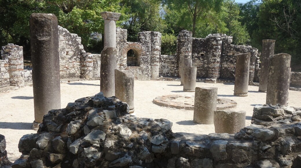 Butrint, a Unesco World Heritage site.
Inhabited since prehistoric times, Butrint has been the site of a Greek colony (800 BC), a Roman city (44 BC) and a bishopric (5th centrury). Following a period of prosperity under Byzantine administration, then a brief occupation by the Venetians, the city was abandoned in the late Middle Ages after marshes formed in the area. The archaeological site is a repository of ruins representing each period in the city’s development and that entity is unique. Moreover the ruines are situated in a beautiful natural setting.
The photo shows the famous baptistery, a major ruin from the 6th century and an ancient Roman monument adapted to the cultural needs of Christianity. Its floor has a an exceptional and well-preserved mosaic pavement, but usually it’s covered with sand (for protection). #Culture #LocalSecrets #History