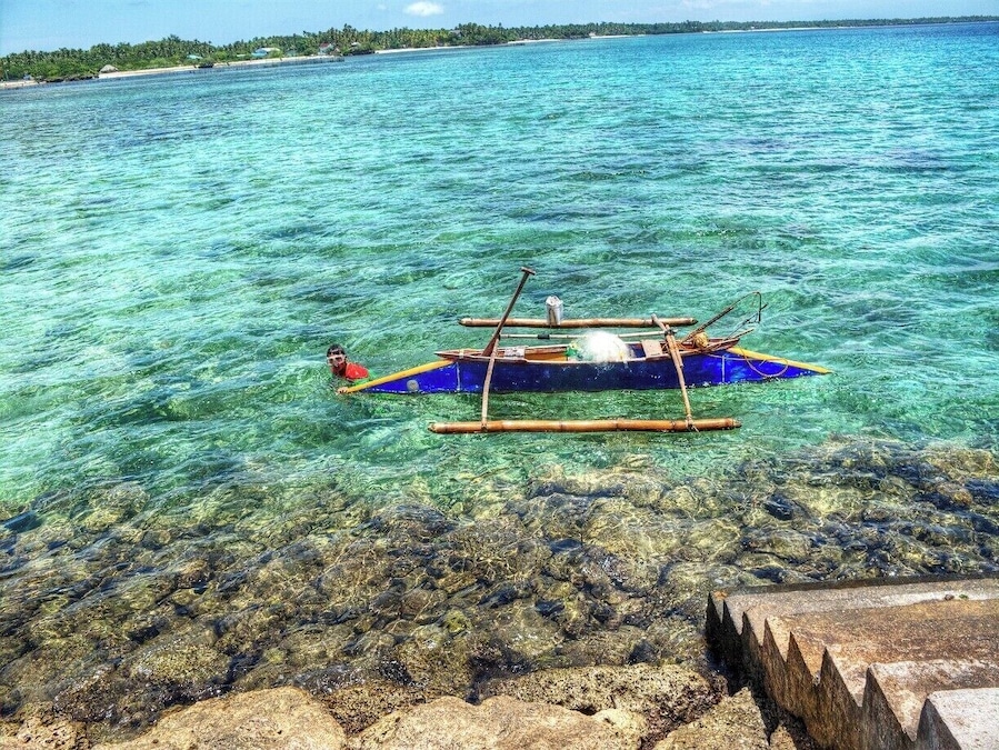 #TroveOn We were at the end of the Lilo-An Boat Terminal pier and we watched this kid diligently collecting seafood. #santander #cebu #philippines #travelationship #fishing #pier #ocean
