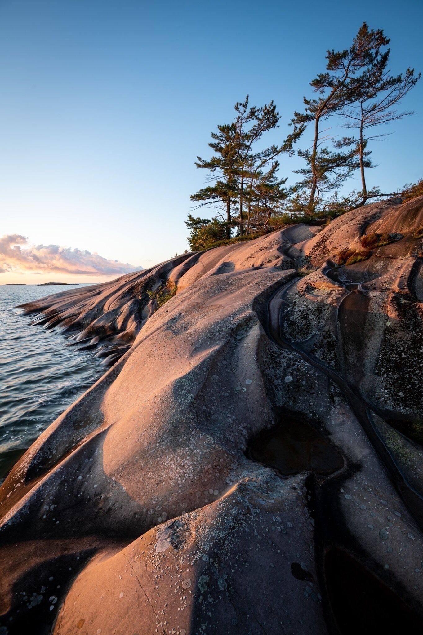 Sunrise on the pink granite of secluded west fox island.