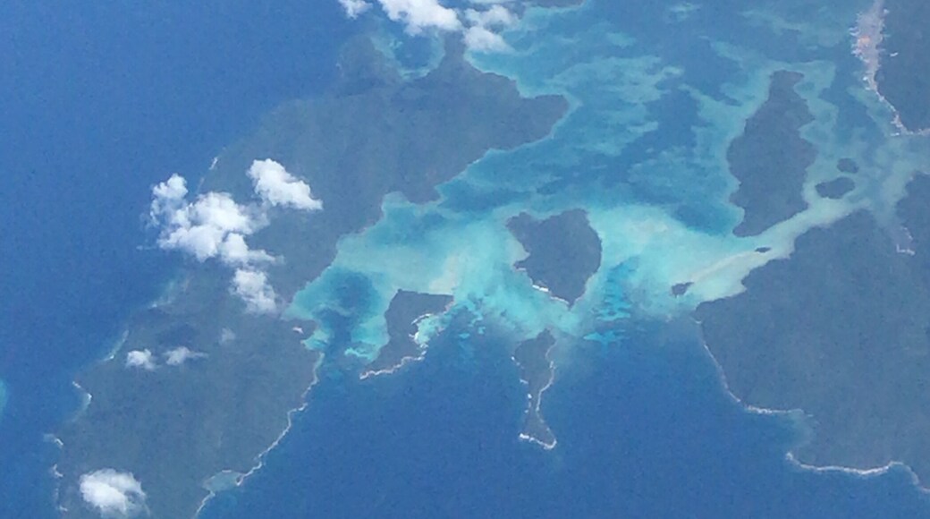 Looked down to find some stunning natural beauty. A cluster of #islands off the eastern coast of #Malaysia #beautiful shades of blues and greens. #view from my #airplane window #middleofnowhere over the south #China #sea #lifeatexpediagroup