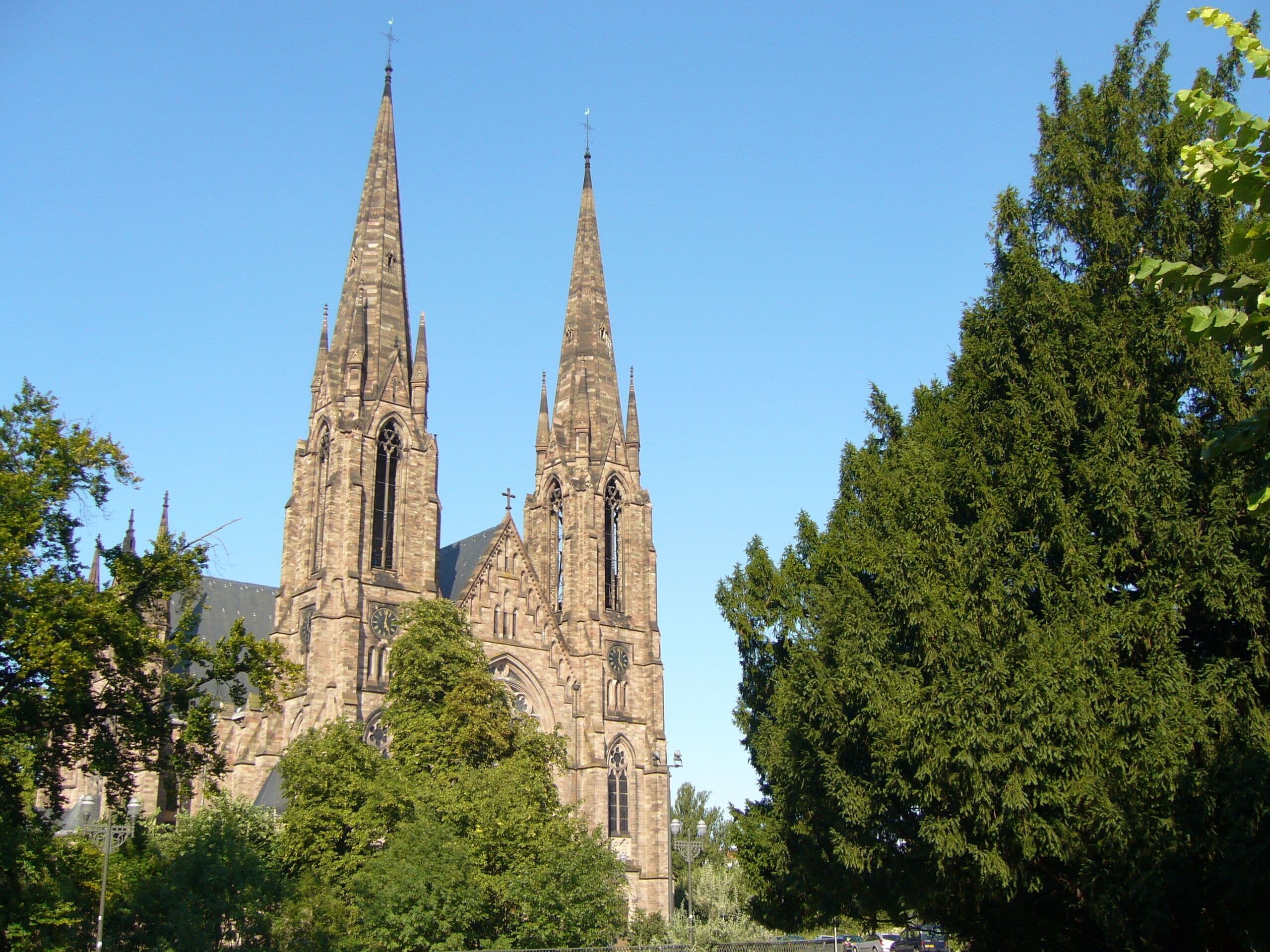 A historic church with two tall spires and intricate architecture.