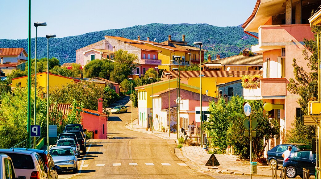 Street Cityscape of car road at Giba at Carbonia Iglesias at Mediterranean Sea in South Sardinia in Italy. Sardinian Italian small town in Sardegna. Urban district. Cagliari province. Mixed media.