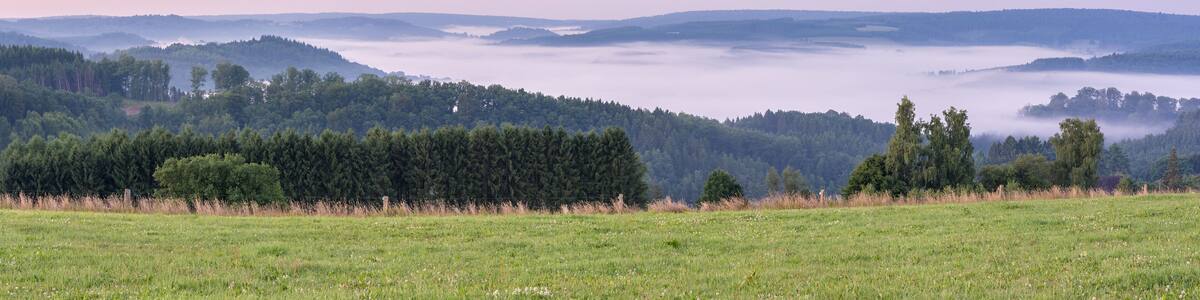 Belgian countryside - Ardennes. View over the Semois valley covered by clouds in the Belgian Ardennes in the early morning.