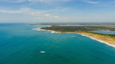 Tropical landscape of the island of Sri Lanka with beaches, ocean and agricultural land.