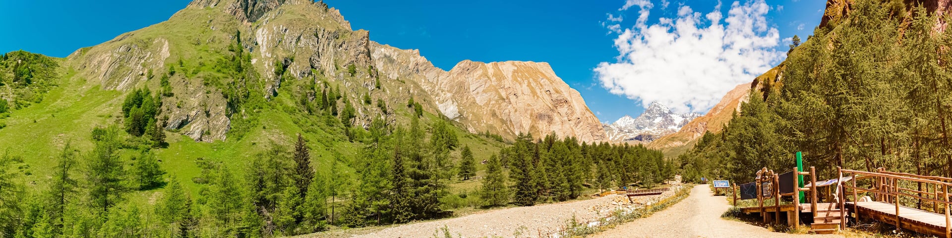 High resolution stitched alpine summer panorama with Mount Grossglockner in the background at Kalser Glocknerstrasse road, Kals, Lienz, Tyrol, Austria