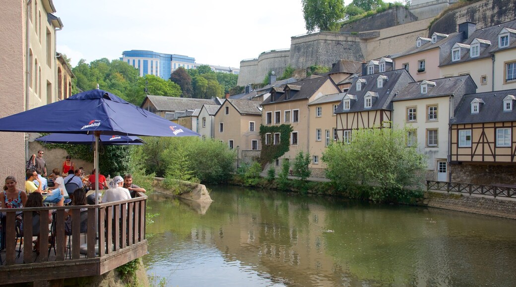 Luxembourg showing outdoor eating, heritage architecture and a river or creek