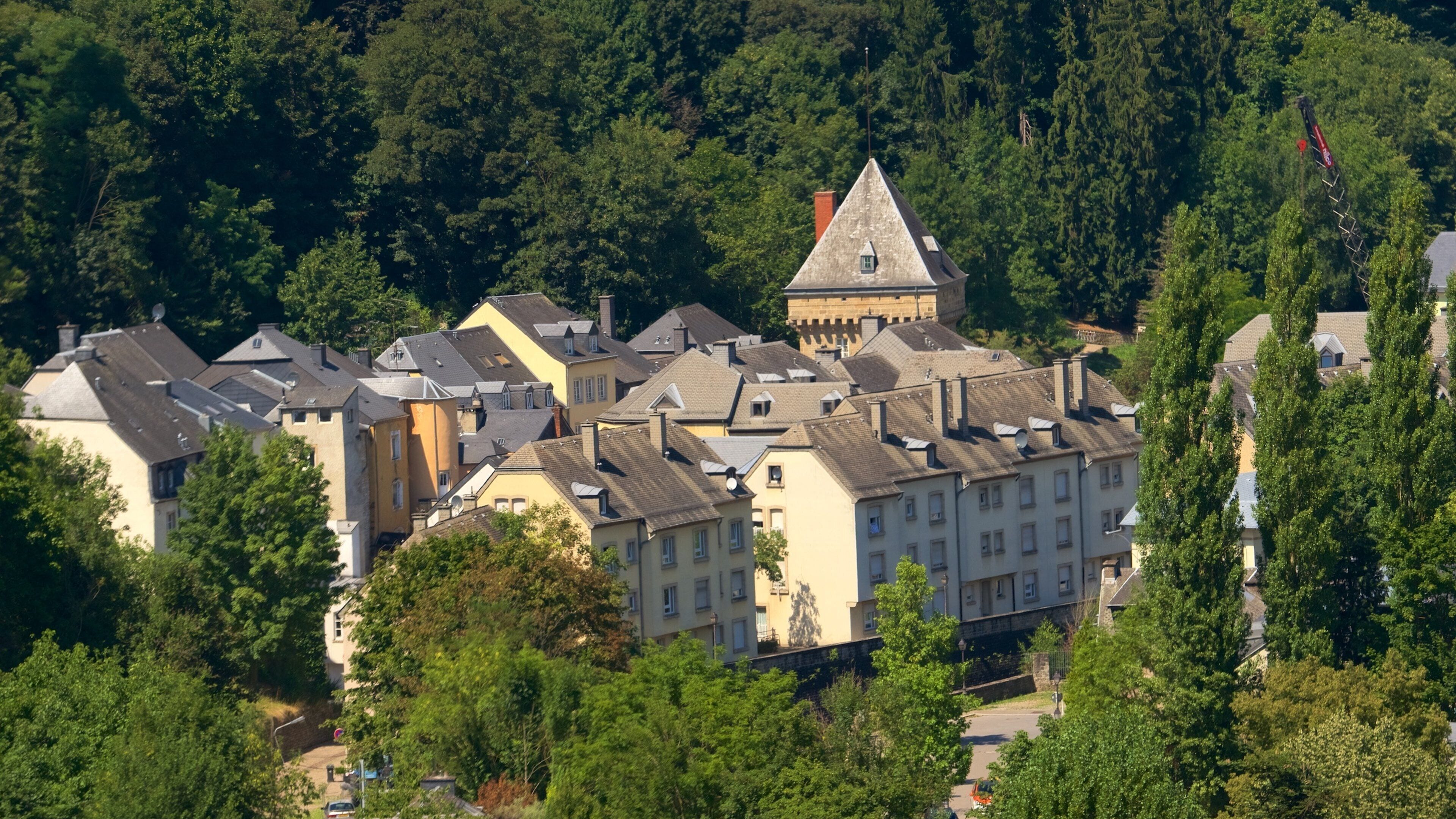 A town with historic buildings and a prominent tower.