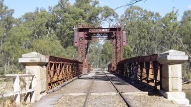 The Tocumwal Historic Bridge
The Tocumwal Rail Bridge over the Murray River was built in 1895 as a road bridge. When the railway arrived in 1908 it was strengthened and was used for both road and rail traffic until November 1987. A concrete road bridge was provided for road traffic a short distance upstream, with the old bridge used for rail traffic only since that time.