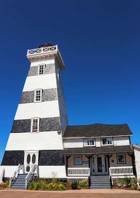 West Point Lighthouse was the second lighthouse I visited while on the island. This lighthouse is unique from the others as it's considered a second generation of lighthouses due to its shape. You will also notice that the lines are painted black instead of red like other houses. This was done because the lighthouse was difficult to see due to its reflection off the red sandy beaches or how the sun reflected off the building. This made it easier for sailors to spot it during bright conditions. There is a small fee to visit the lighthouse, and you can go right to the top to view it actually working. So many lighthouses I've been to are no longer active so this was a treat to see.