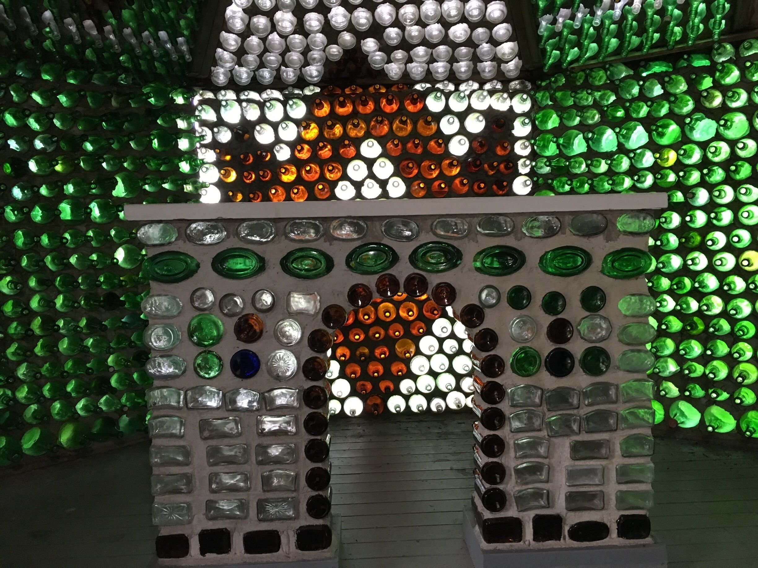 Known as the Bottle Cottages on Prince Edward Island. There are three cottages constructed of thousands of bottles. This was inside the Chapel.