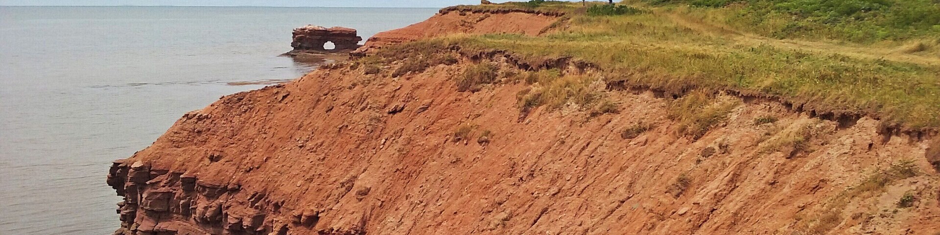 Cape Egmont's lighthouse overlooks a natural rock arch. #beachtips