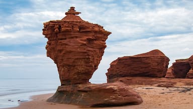 The Tea cup or pot a Red sandstone rock formation, sea stack, on a north shore beach in Darnley area of Prince Edward Island Canada, waves erode the lower rock leaving a free standing structure; Shutt