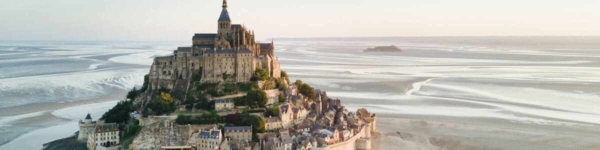 Le Mont Saint-Michel tidal island in beautiful twilight at dusk, Normandy, France
