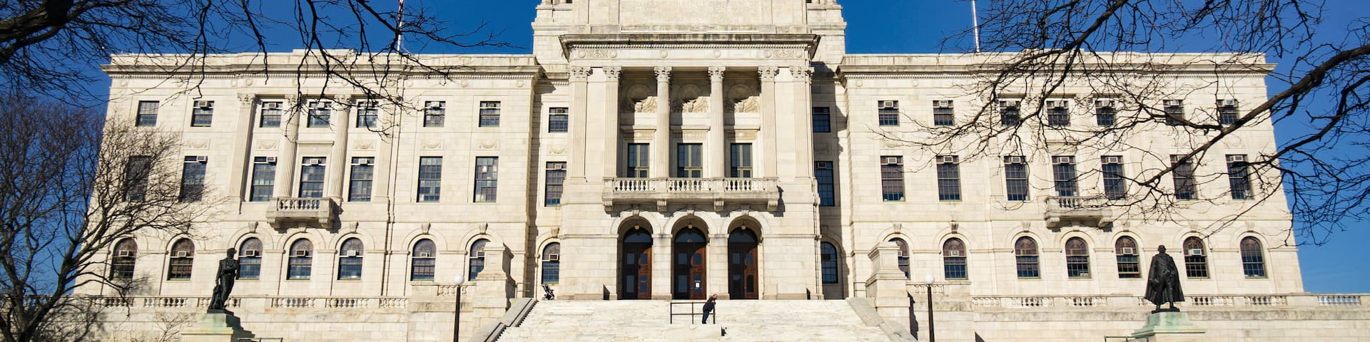 The Rhode Island State House is the capitol of the U.S. state of Rhode Island. It is located on the border of the Downtown and Smith Hill sections of the state capital city of Providence.; Shutterstoc