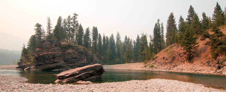 Curving riverbank where the Flathead and Spotted Bear Rivers meet in the Bob Marshall wilderness area during the 2017 fall fires in Montana United States