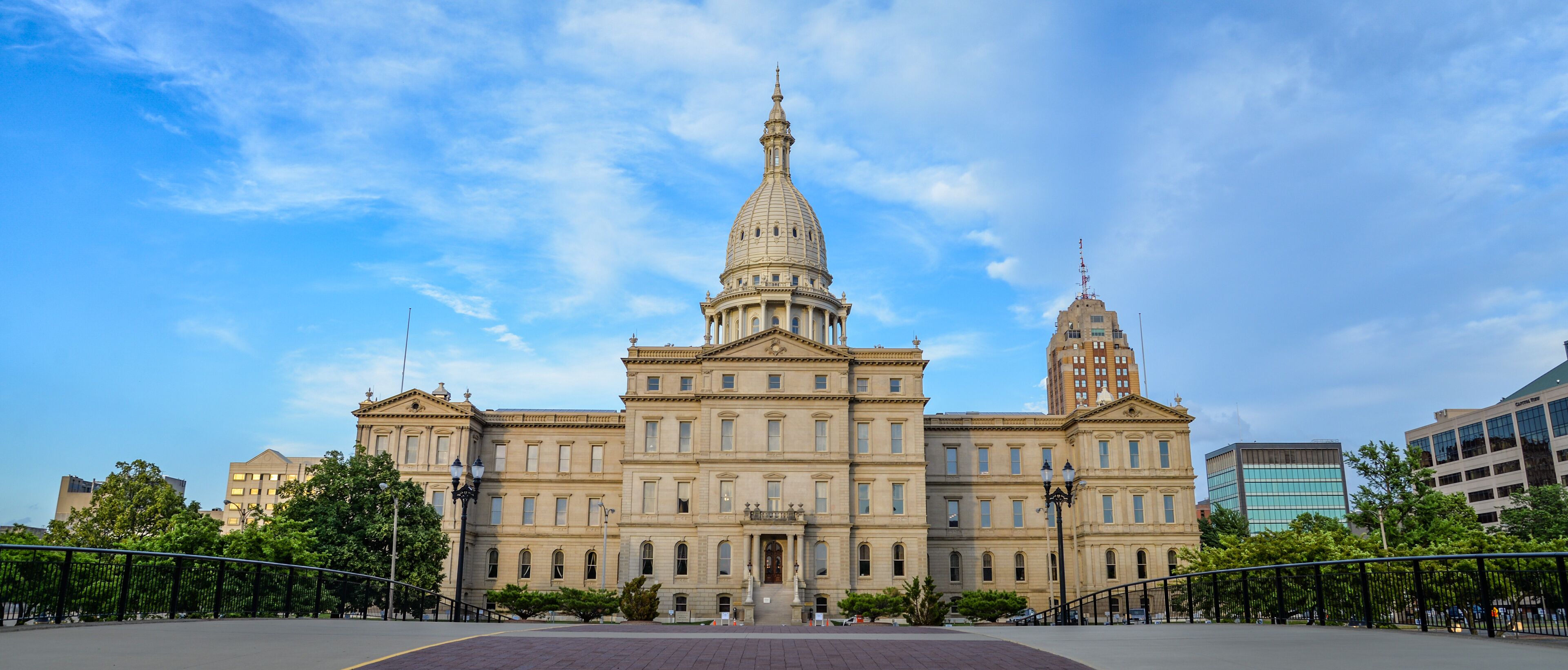 A large, historic building with a prominent dome and a tall tower.