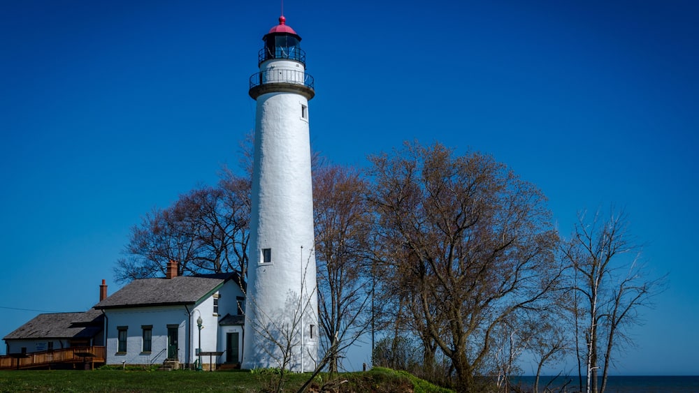 Port Aux Barques lighthouse looking over Lake Huron in Port Hope Michigan on a spring sunny morning
