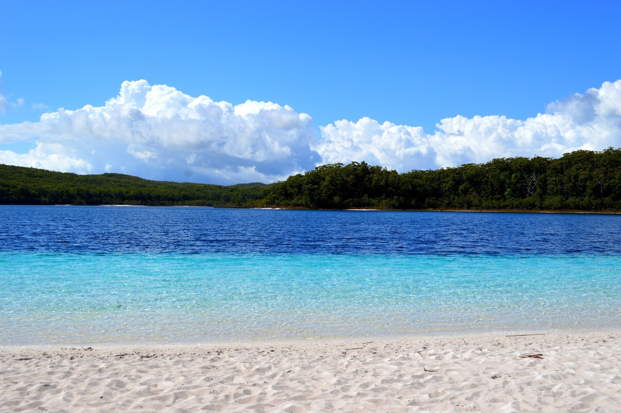 This is probably the best place I have been to in the world. 
It is a 'Natural Beauty Salon'.  
Rated as one of the WORLDs TOP 10 MUST SWIM IN LAKES. A pretty fancy title for a little island atoll just off Queensland’s sunshine coast. Lake Mackenzie is mind-blowingly beautiful. The pure white sand is so soft and acts as a brilliant exfoliate. The water is cool, fresh, crystal clear, and an array of blues. The dark blue section of the lake is extremely deep. Lake Mackenzie left its mark on both our memories and physically by conditioning our hair and leaving our skin silky smooth. It is truly natures Beauty Salon. 
Read more on Fraser here ...https://www.facebook.com/4pairsofItchyFeet/posts/1059271060810581