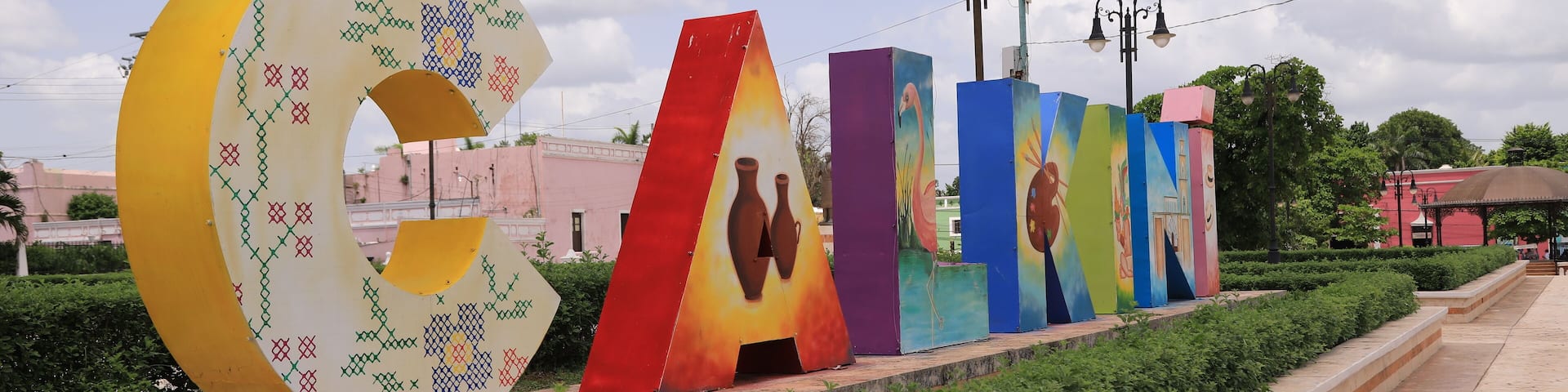 A series of colorful, abstract sculptures along a pathway.