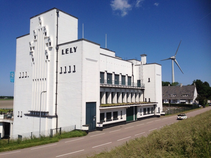 Seemingly random along the Dutch dikes you will find structures like this, which hide a pumping station. Named after Cornelis Lely, one of many who changed the Zuiderzee into the IJsselmeer.
Many buildings are plain ugly by all possible definitions, this one is a nice exception. Style: New pragmatism. They are even more impressive when they engines are running. - No Holland without them! #greatdesign