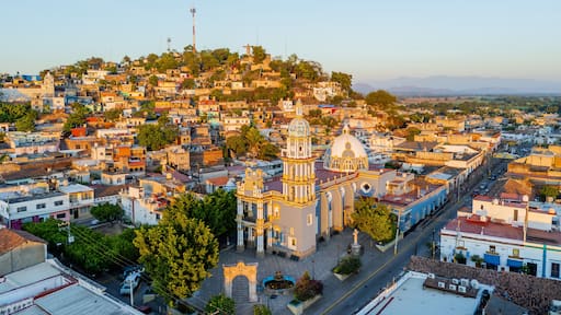 Santiago Ixcuintla church and colorful houses at sunrise, aerial view, Nayarit, Mexico