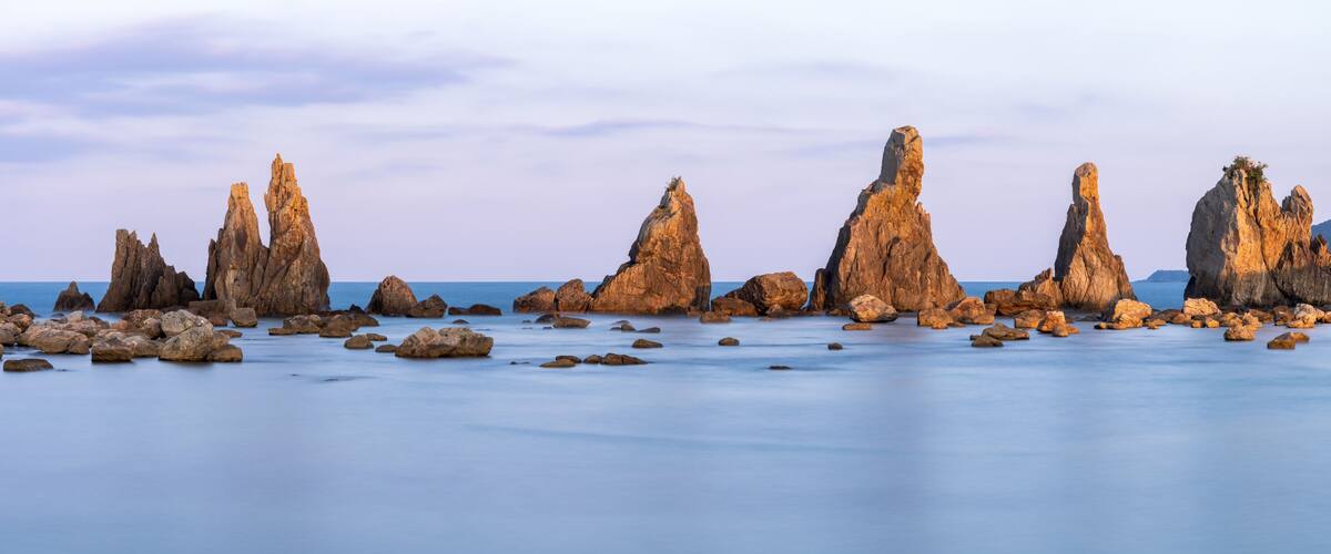 A coastal landscape with prominent rock formations.