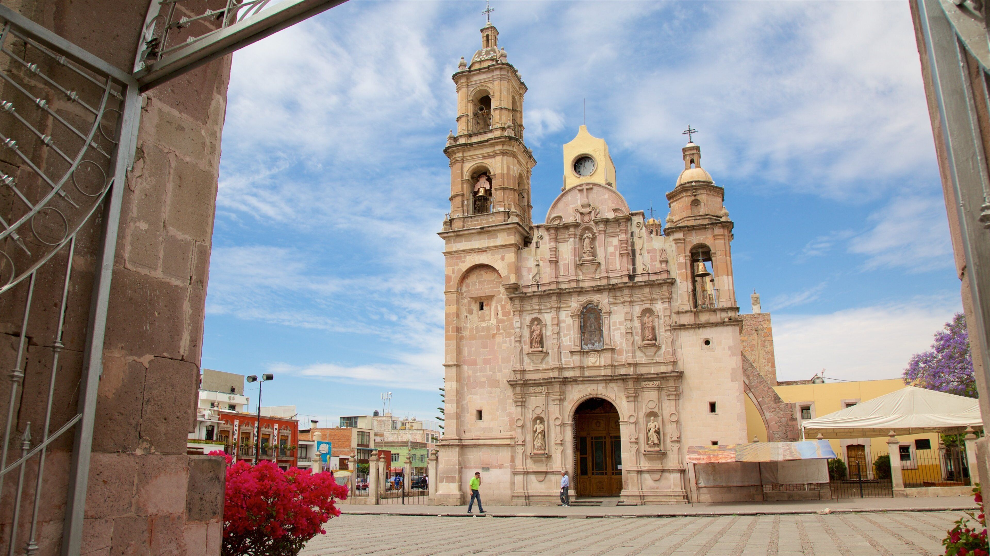 A historic church with two bell towers and a dome.