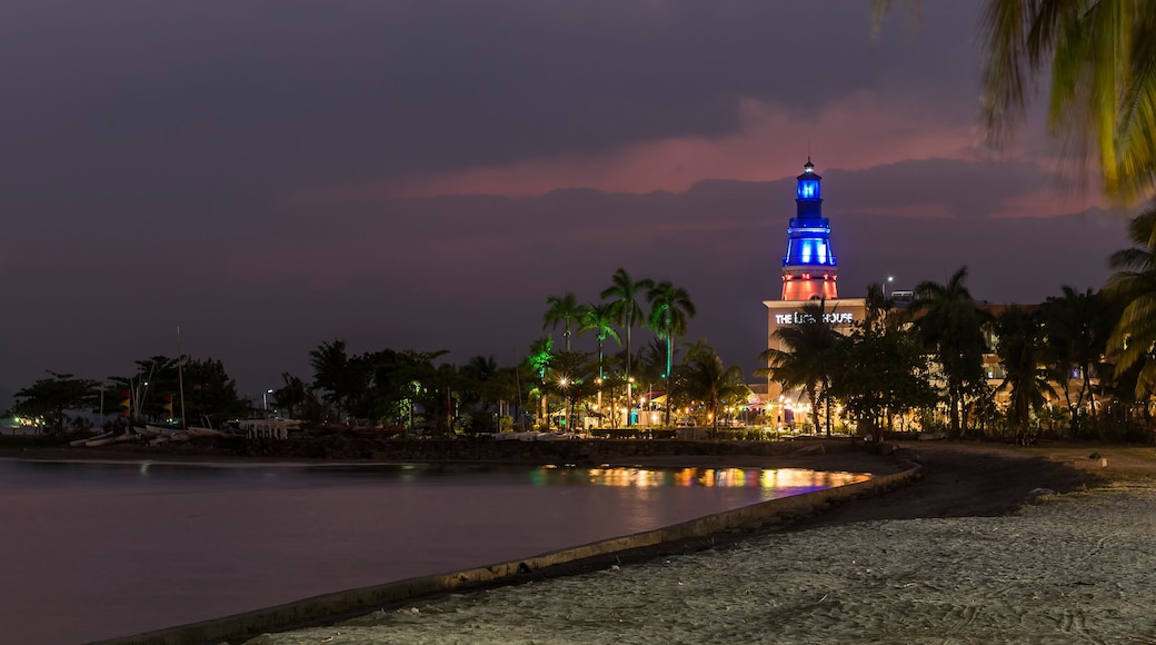 Subic, Philippines - SBMA Beach at sundown. The scenic Lighthouse Marina Resort lit at night.