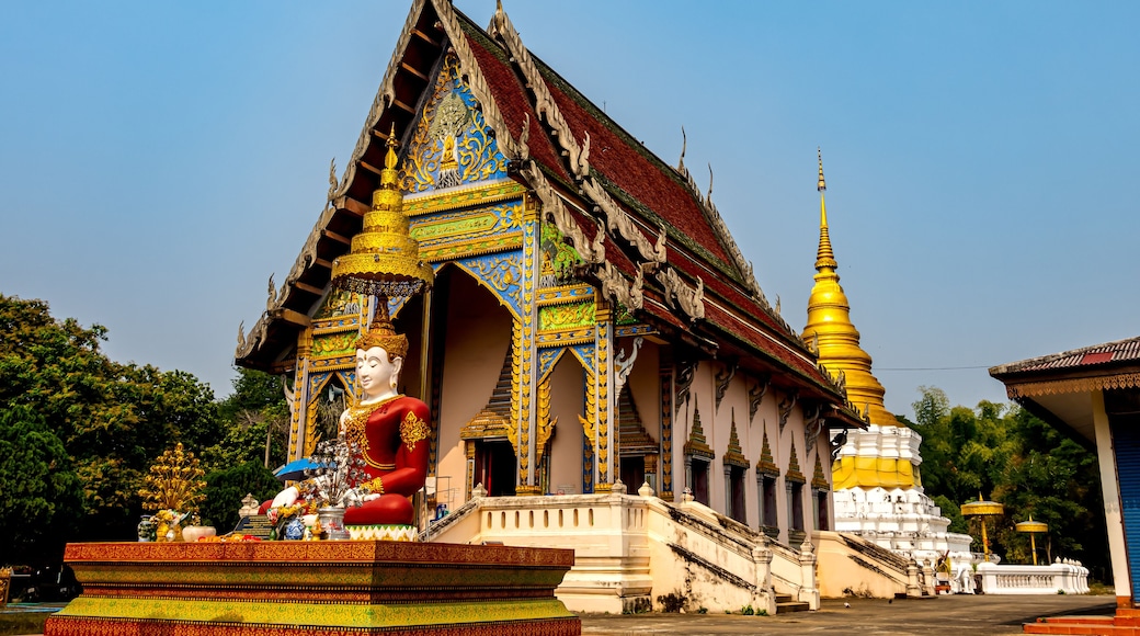 Wat Khu Kum, the ancient buddhist temple with the big Seated Buddha, the new main hall that build in April 27. 1972 /2515 and the Pagoda in Muang District, Lampang Province, Thailand.