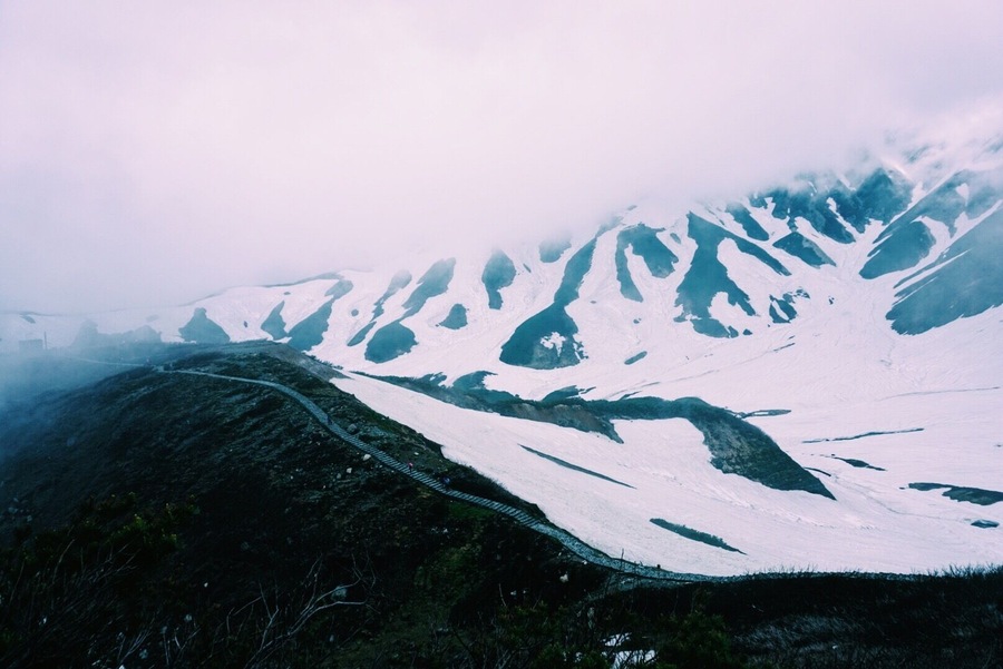 Took a bit of a hiatus recently to go to #japan and it was everything I dreamed and more. Thought this shot was an appropriate #takeahike entry as it was not something I expected to see in the middle of Japanese summer! Leaving in the morning from Toyama in 27+ degree (Celsius) heat to do the Tateyama Kurobe Summer Alpine Route, I thought the rest of the day would be spent in a T-shirt. What a beautiful surprise! Snow and volcanic scenery. And we even drove past some snow monkeys 💙. Falling hard and fast for Japan and its trekking routes, and finally making my Trover wishlist dreams a reality! (Tip: many more trekking routes are open in summer that wouldn't usually be accessible).