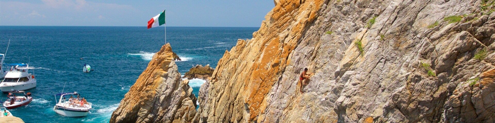 Acapulco Tradicional which includes rocky coastline and general coastal views