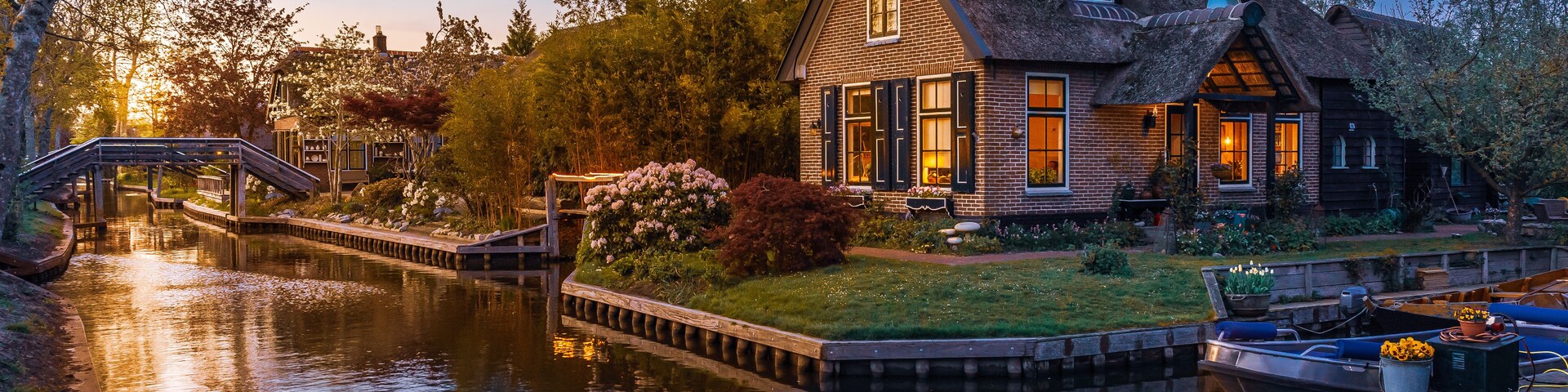 Lovely sunset over canal and picturesque houses, Giethoorn, Netherlands