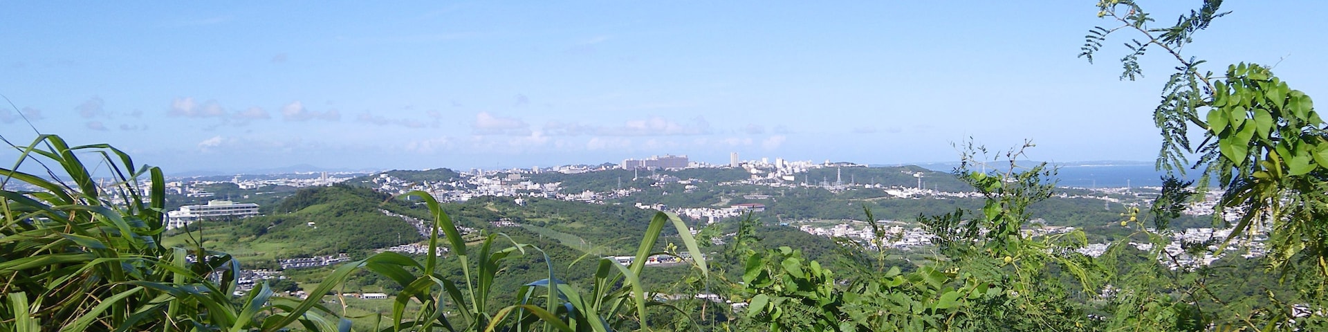 Panoramic view for Nishihara Town, taken from Fītatimō, a hill nearby Bengadake, Naha, Okinawa, Japan.