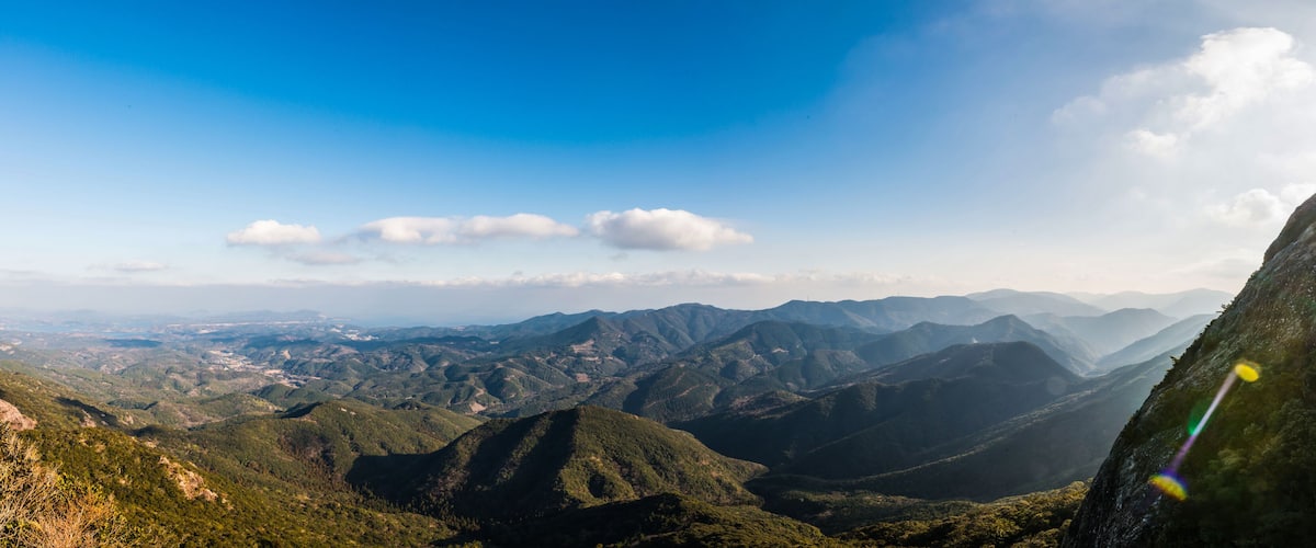 A mountainous landscape with a clear sky.