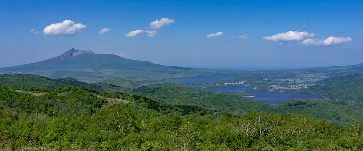 Panoramic view of Mt. Komagatake and Onuma Lake seen from Kijihiki Highland in Hokuto city, Hokkaido, Japan
