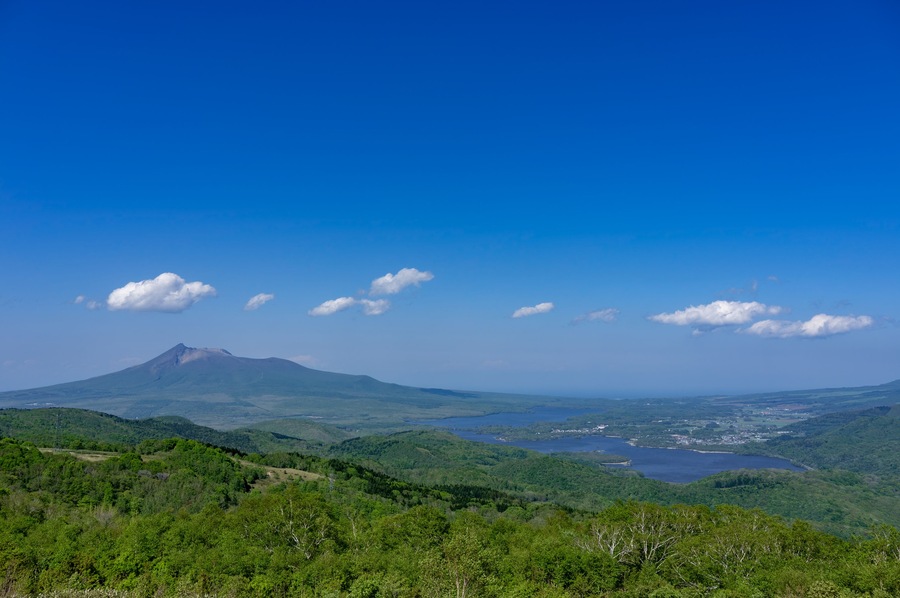 Panoramic view of Mt. Komagatake and Onuma Lake seen from Kijihiki Highland in Hokuto city, Hokkaido, Japan