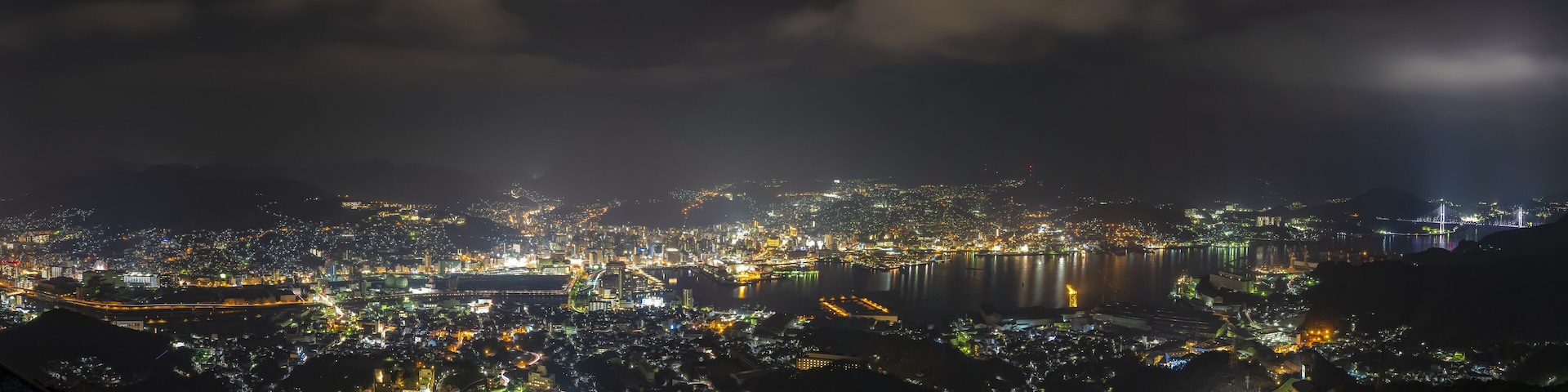 Nagasaki city light up at night. Panorama nightscape from Mt Inasa observation platform deck. Famous beauty scenic spot in the world, the 10 ten million dollar night views. Nagasaki Prefecture, Japan