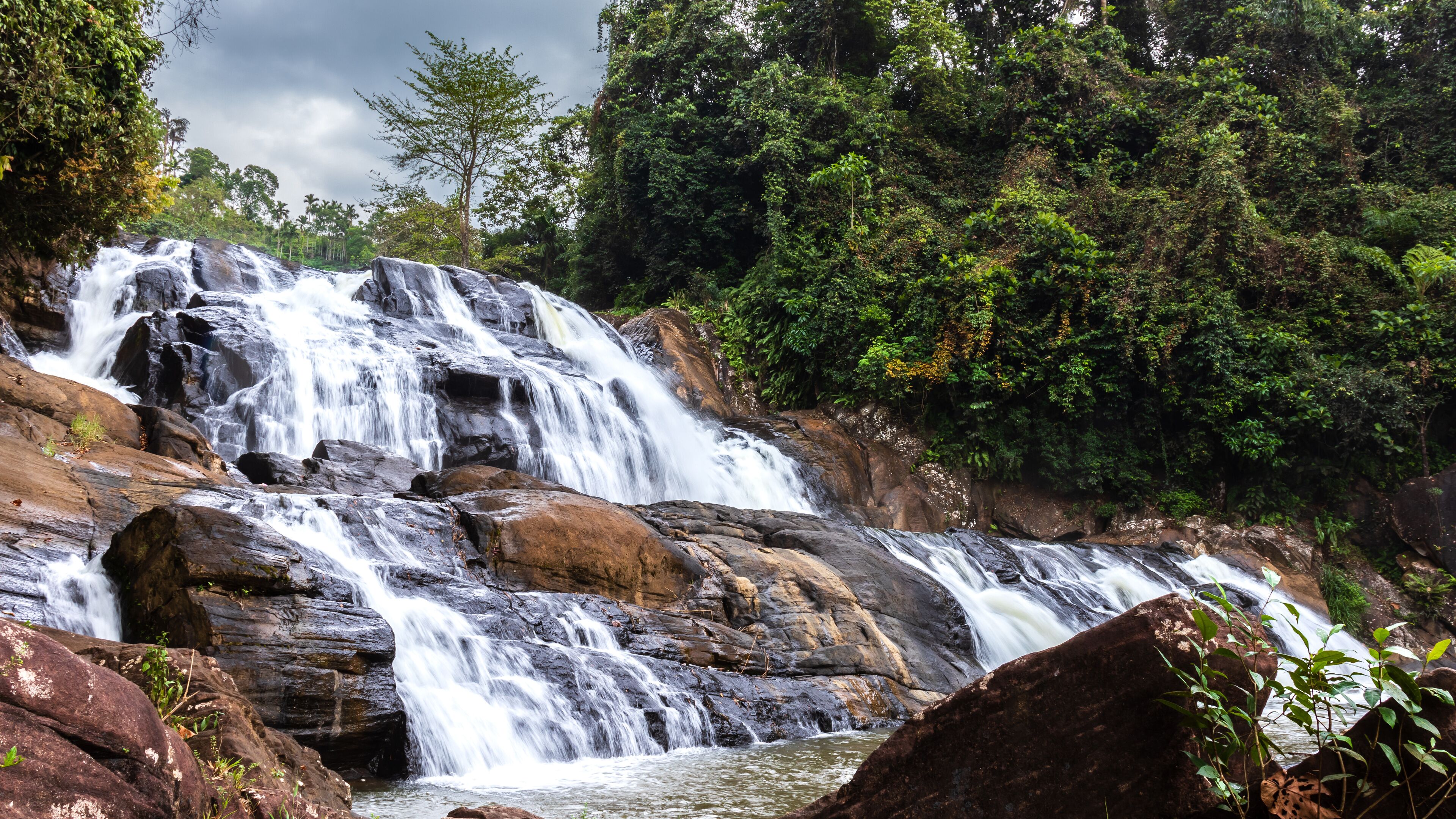 Sathmahal Waterfall in deniyaya moody dark sky landscape photography