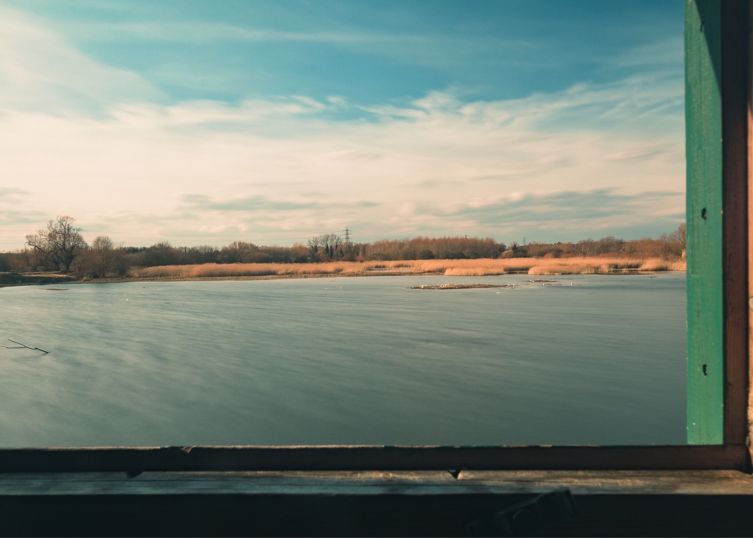 View from Draper Hide. I used a long exposure to smooth out the water and a polariser to bring out the clouds and take glare off the water. 