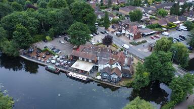 Aerial view of riverside pub and housing estate in Hoddesdon UK