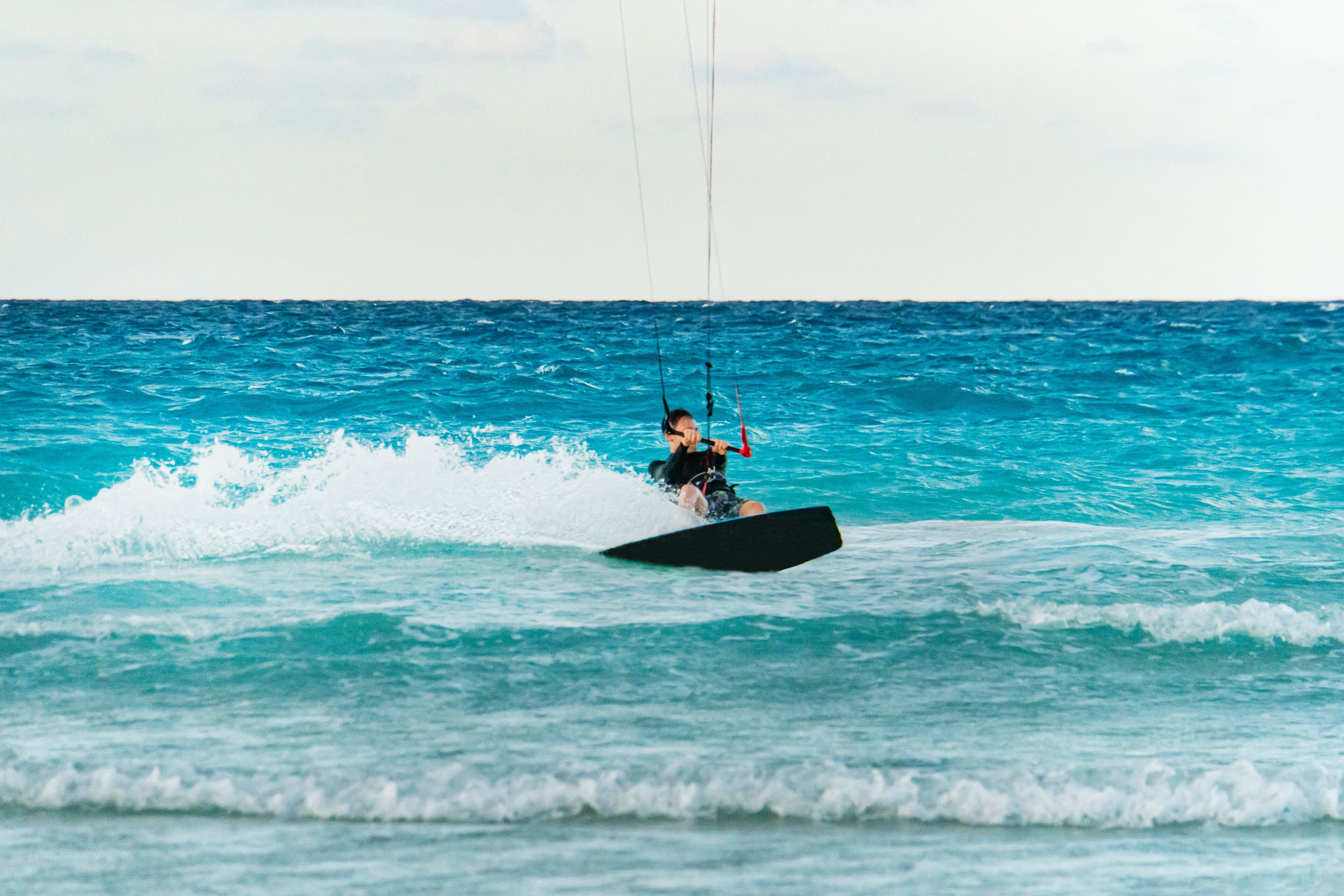 kiteboarder kitesurfer athlete performing kitesurfing kiteboarding tricks unhoocked