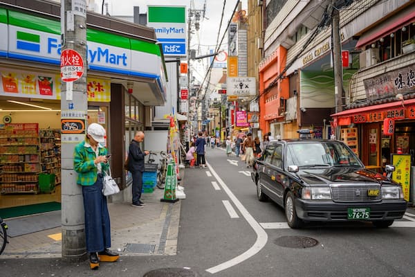 Amerikamura featuring a city and street scenes as well as an individual femail