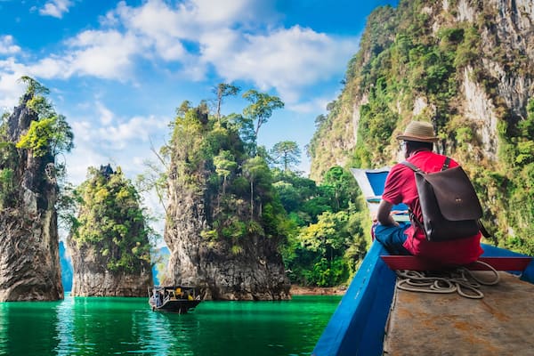 Panorama man traveler on boat joy nature rock mountain island scenic landscape Khao Sok National park, Famous travel adventure place Thailand, Tourism beautiful destinations Asia holiday vacation trip