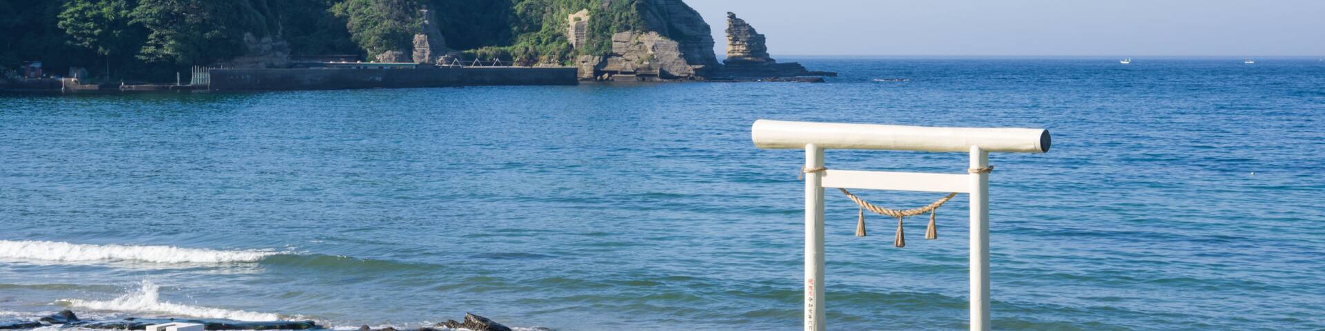 Ubara, Chiba, Japan , 09/01/2019 , Torii gate in Ubara beach. it symbolically marks the transition from the mundane to the sacred.