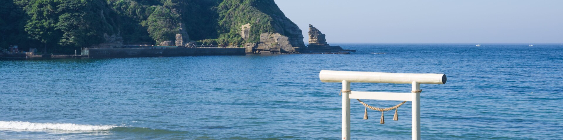 Ubara, Chiba, Japan , 09/01/2019 , Torii gate in Ubara beach. it symbolically marks the transition from the mundane to the sacred.