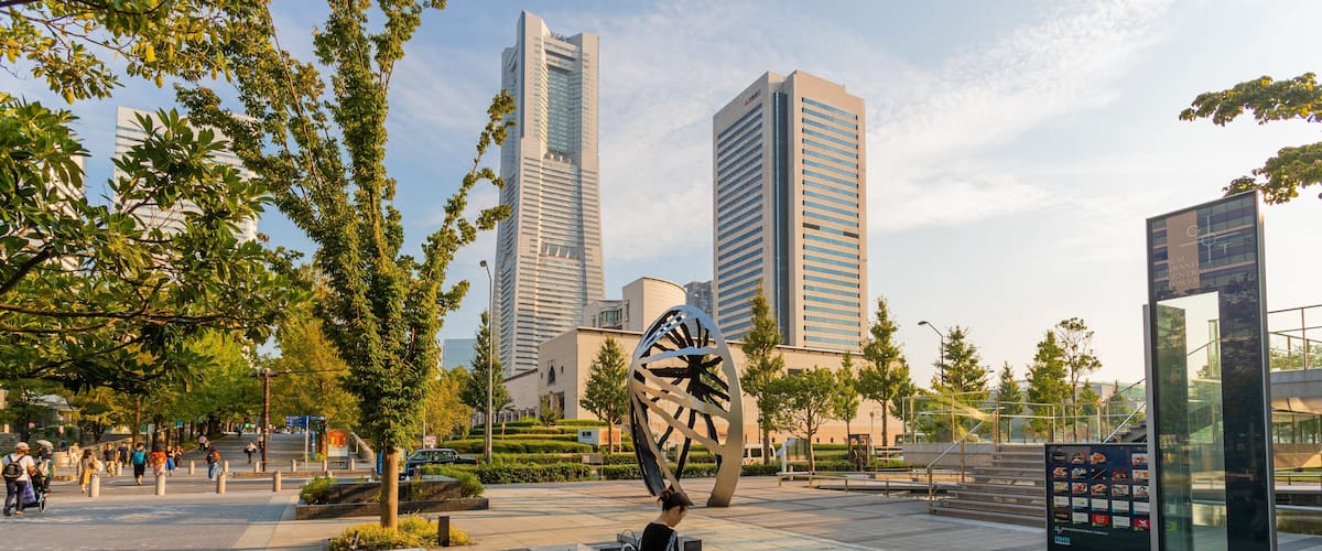 Minato Mirai 21 showing a sunset, outdoor art and a square or plaza