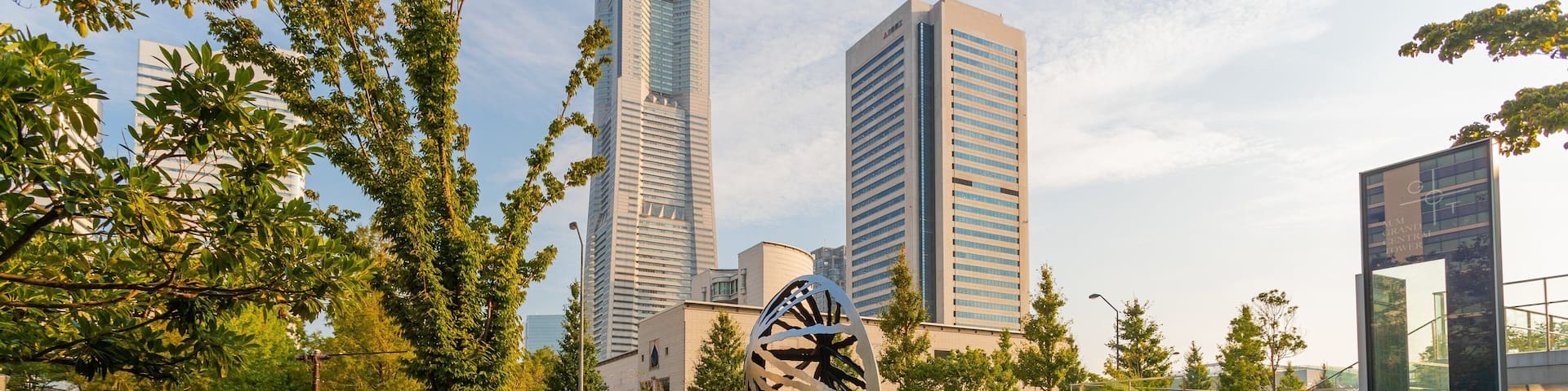 Minato Mirai 21 showing a sunset, outdoor art and a square or plaza
